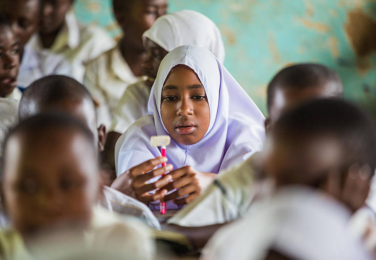 Muslim African girl in class. COALITION FOR GOOD SCHOOLS.