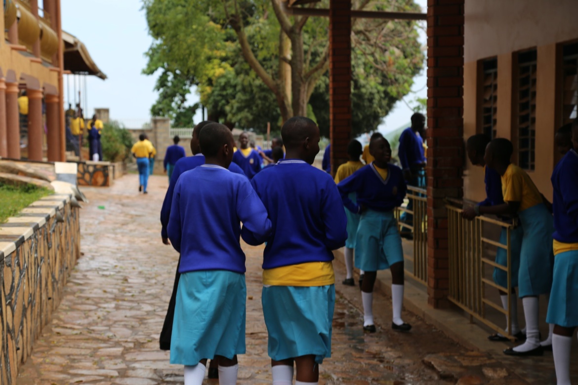 Ugandan schoolchildren walking and talking. Coalition for good schools.